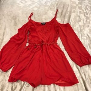 Bebe coral romper with gold chain and pockets